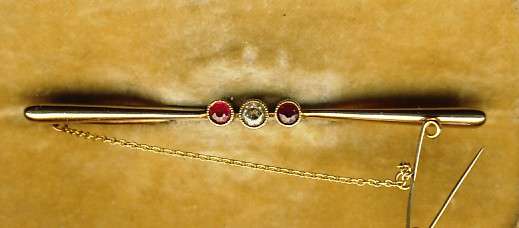 Antique diamond & ruby brooch set in 18 carat gold - with safety chain