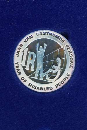 1986 Year of the Disabled silver R1 Proof in SAM box - nice toning