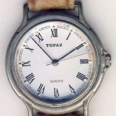 Topaz quartz watch with leather strap as per scan - needs battery - as is