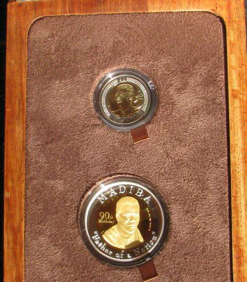 Mandela 90th Birthday Celebration Set with 1/2 oz pure Gold Medal and R5 Unc in Wooden Box.