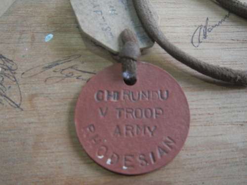 Rhodesian plaque with matching dog tags - signed at the back by members  V Troop
