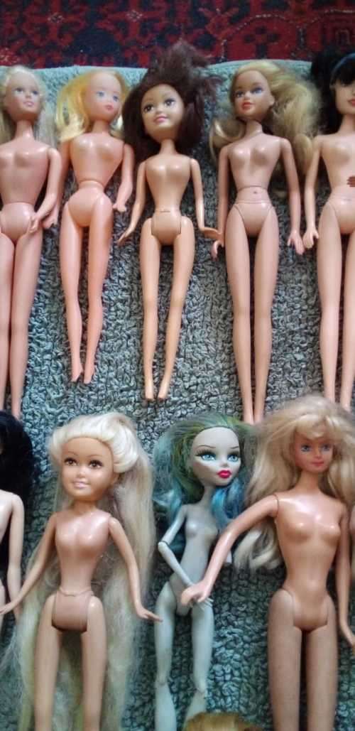 A Collection of 15 Dolls Including a 1966 and 1968 Mattel Ken and Barbie