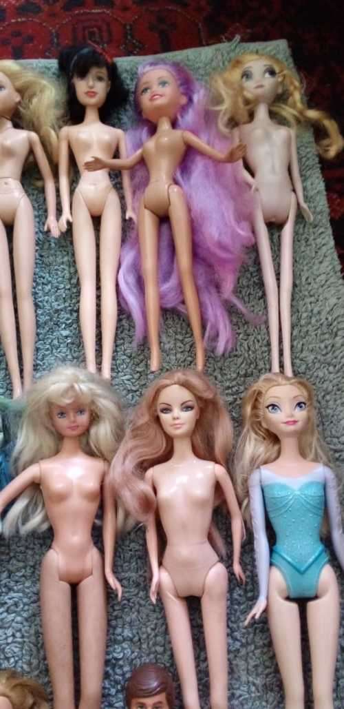 A Collection of 15 Dolls Including a 1966 and 1968 Mattel Ken and Barbie