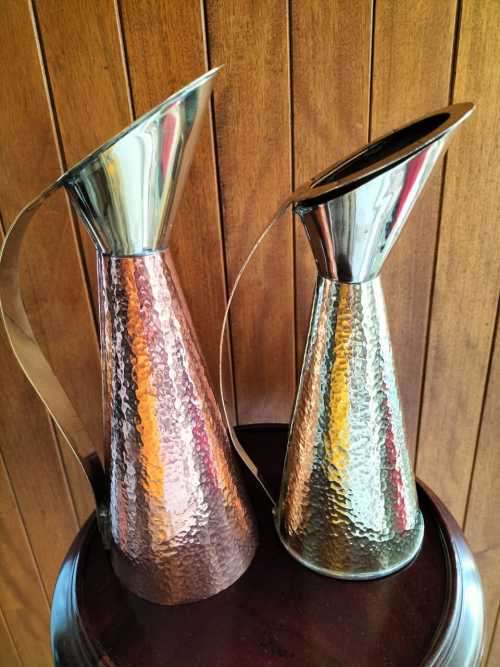 An Absolutely Magnificent Pair of Hammered Brass/CopperJugs
