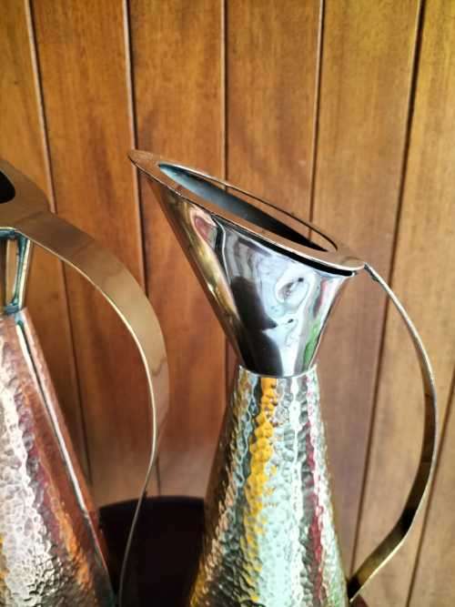 An Absolutely Magnificent Pair of Hammered Brass/CopperJugs