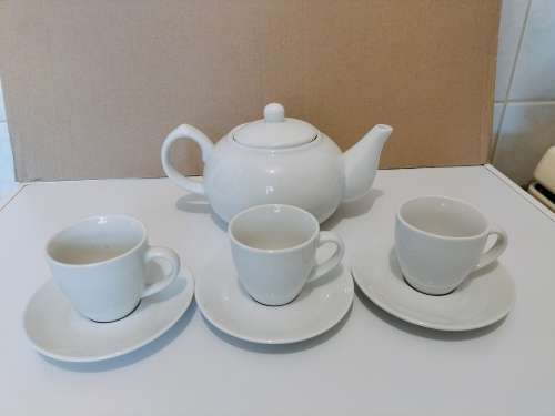 Concept Living Tea Pot with Three Cups and Saucers