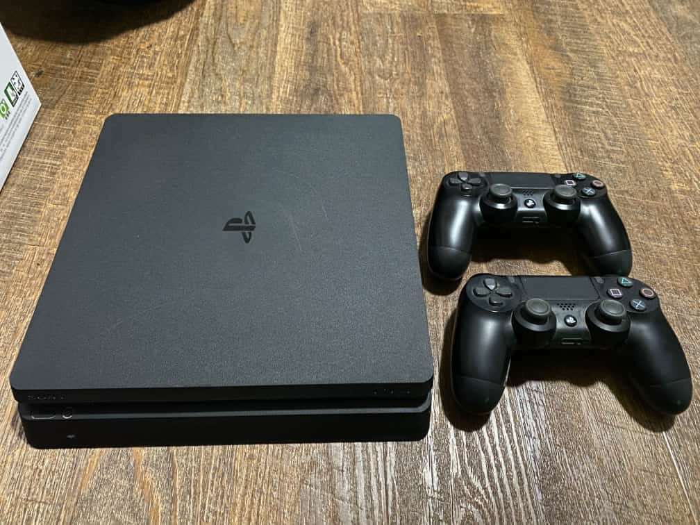 PS4 Slim 1TB with 2 Controllers & 4 games