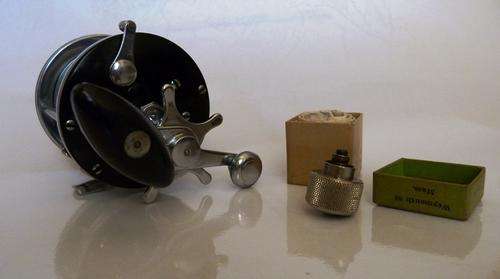Fishing reel- J A Cox, model no 1215 with fluid(oil) anti backlash attachment