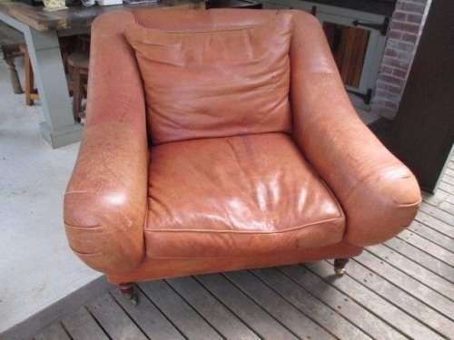 Leather Armchair on brass castors