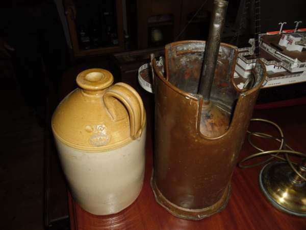 STONEWARE BOTTLE WITH BRASS FILLER