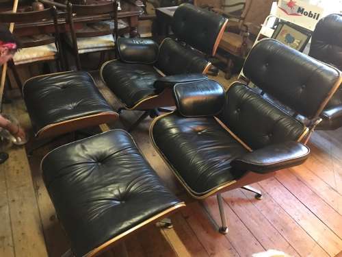 Eames Type Chairs: pair of leather chairs with ottomans