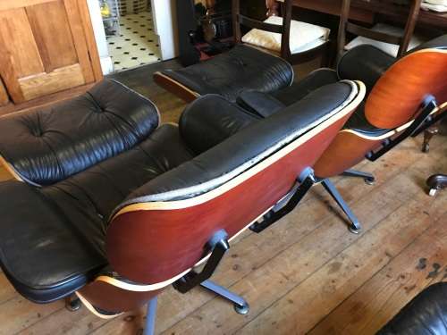 Eames Type Chairs: pair of leather chairs with ottomans