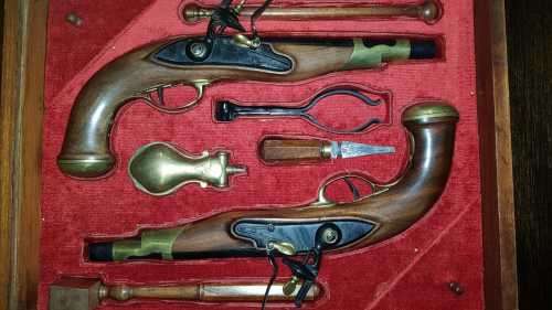 Pair of top quality Duelling Flintlock Pistols in glassed box. ( Only ornamental ) 47 x 35 x 8 cm