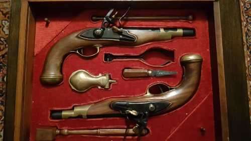 Pair of top quality Duelling Flintlock Pistols in glassed box. ( Only ornamental ) 47 x 35 x 8 cm