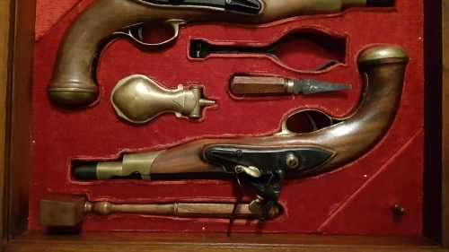 Pair of top quality Duelling Flintlock Pistols in glassed box. ( Only ornamental ) 47 x 35 x 8 cm