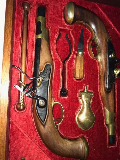 Pair of top quality Duelling Flintlock Pistols in glassed box. ( Only ornamental ) 47 x 35 x 8 cm