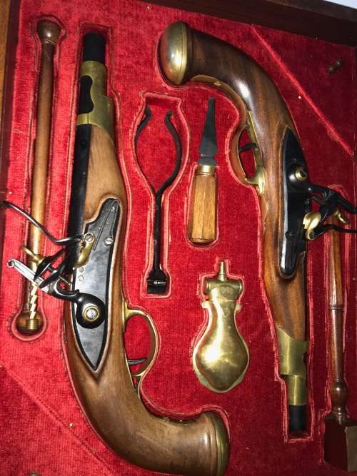 Pair of top quality Duelling Flintlock Pistols in glassed box. ( Only ornamental ) 47 x 35 x 8 cm