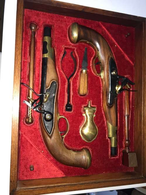 Pair of top quality Duelling Flintlock Pistols in glassed box. ( Only ornamental ) 47 x 35 x 8 cm