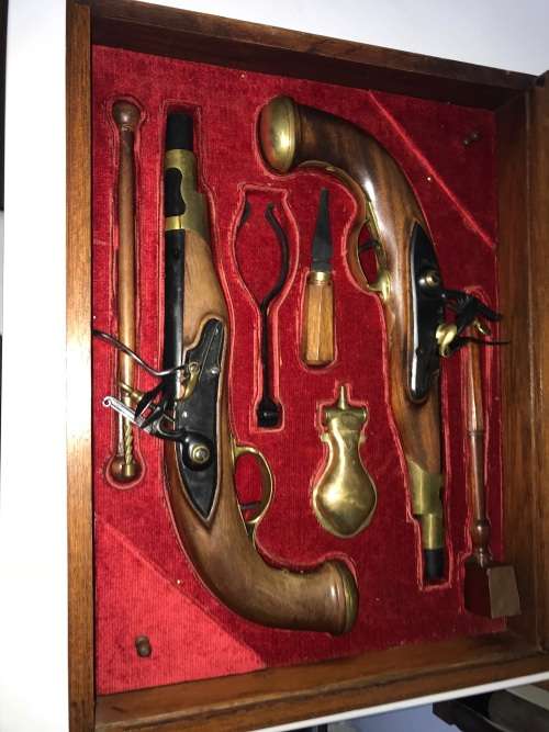 Pair of top quality Duelling Flintlock Pistols in glassed box. ( Only ornamental ) 47 x 35 x 8 cm