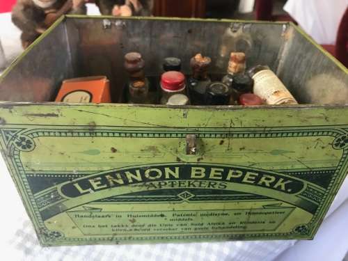 Lennon se Egte Huis Apteek with some medicine in the original packing