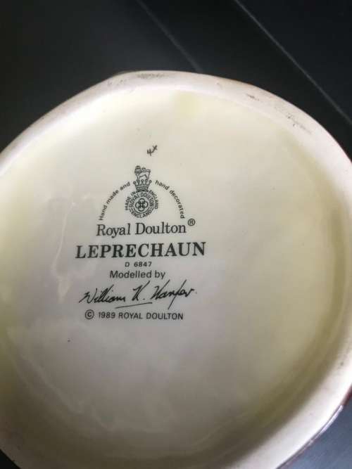 4 ROYAL DOULTON JUGS ( QUEEN VICTORIA , THE INDIAN , SANTA CLAUS , THE LEPRECHAUN )