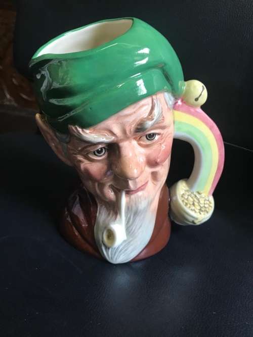 4 ROYAL DOULTON JUGS ( QUEEN VICTORIA , THE INDIAN , SANTA CLAUS , THE LEPRECHAUN )