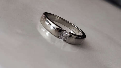 Stunning .25CT - 18 White GP Eng Ring