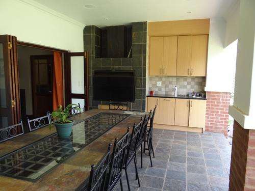 12 to 14 seater patio set. Steel, slate and glass