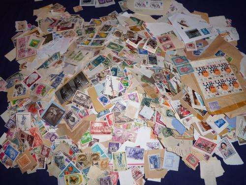 THOUSANDS OF STAMS - 5 Litre container full of stamps