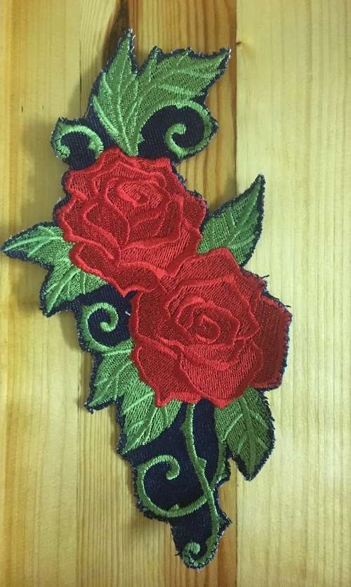 Red and green baroque rose badge patch