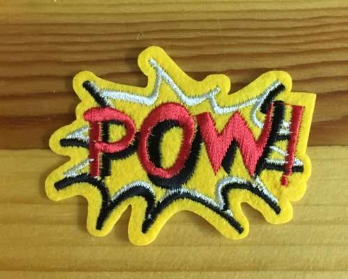 BDG498 Comic POW badge patch small 5cm x 7cm red and yellow