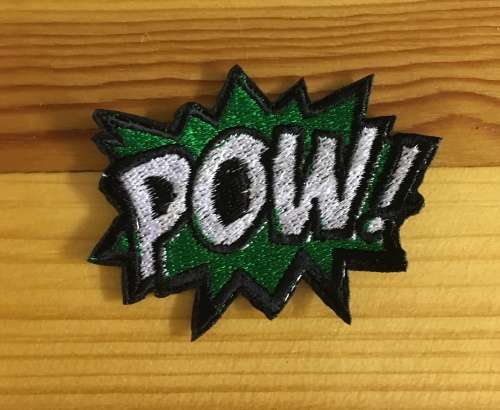 BDG501 Comic POW badge patch small 5cm x 7cm white and green