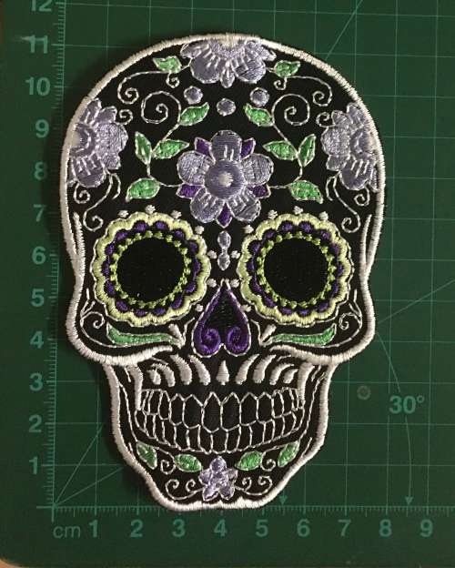 BDG315 Sugar skull badge patch in purple on black