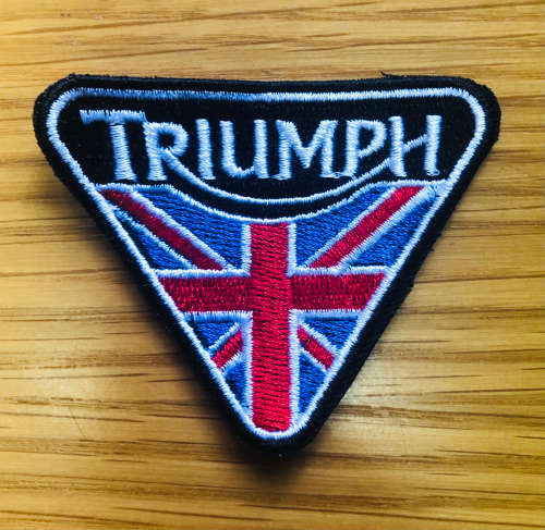 Triumph flag with black and white badge patch
