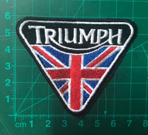 Triumph flag with black and white badge patch
