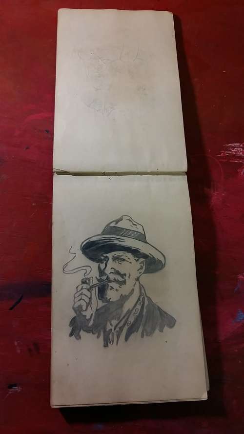 OLD SKETCHBOOK WITH INTRICATE DRAWINGS, DIAGRAMS AND CARTOONS