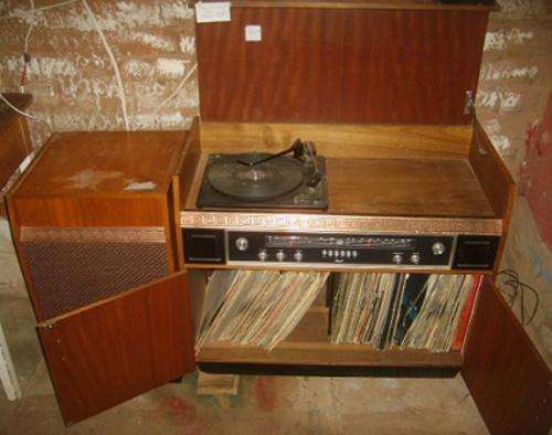 Vintage record player and music center with lots of LP's