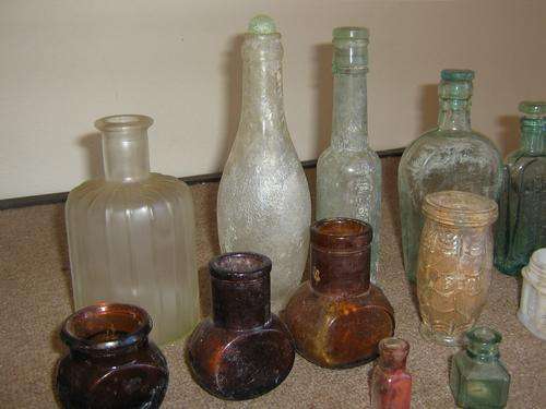 AN OLD COLLECTION OF LOVELY BOTTLES - BOVRIL, MARMITE, PONDS, ETC.