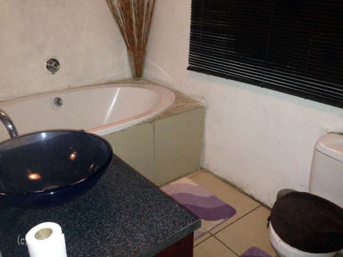 A 2 bedroom house (plus 3 back rooms) is available for sale in Zola North now.