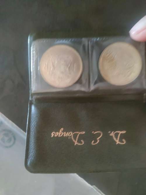 1969 English and Afrikaans R1 coins in holder.