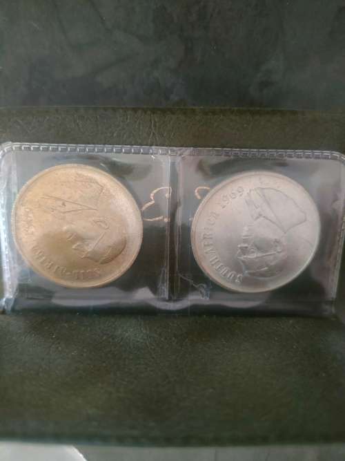 1969 English and Afrikaans R1 coins in holder.