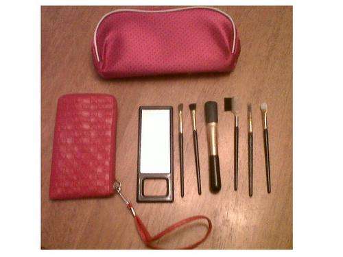 6 Make up brushes and a mirror in a cute red bag. Free cosmetic bag!!