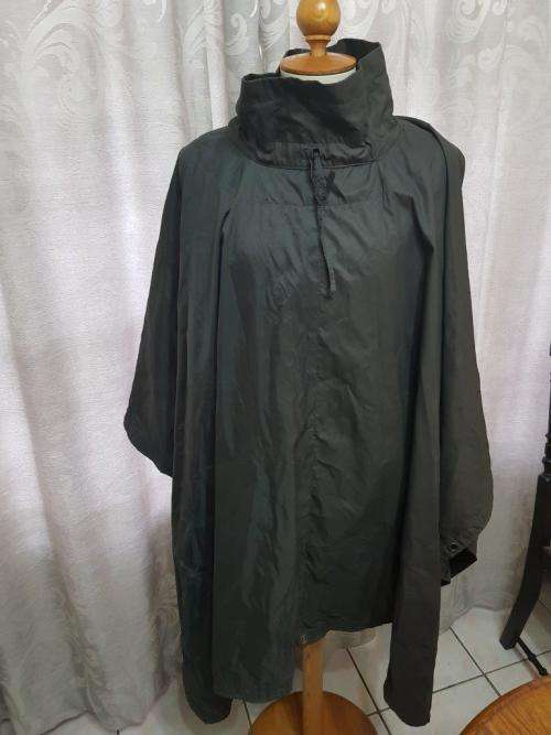 Rhodesian Green Poncho. No holes, but the material is shows some wear on the inside with thinning.