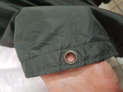 Rhodesian Green Poncho. No holes, but the material is shows some wear on the inside with thinning.
