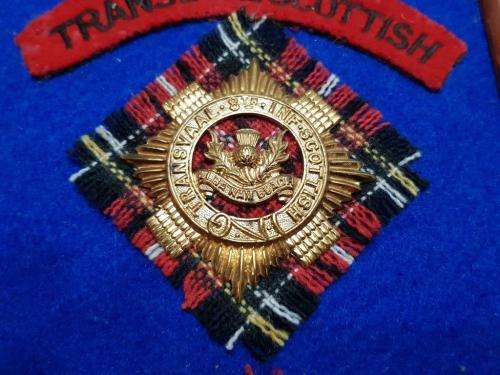 Transvaal Scottish Badges on tartan backings. All lugs intact.