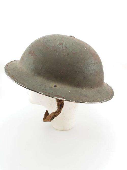 British WWII Helmet. Complete with liner and chin strap.