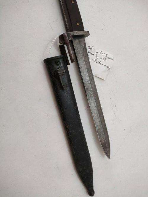 Belguim FN Bayonet and sheath. As used by SAP. Replaced wooden grips and release button missing.