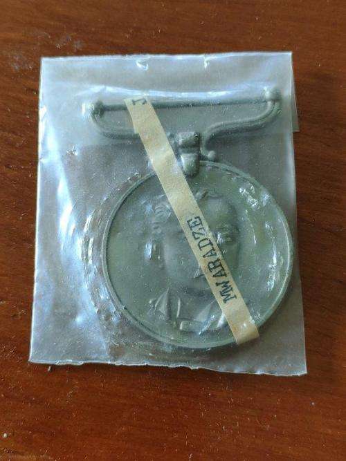 Rhodesain District Service Medal awarded to D.S.A. Mwaradze. In packet of issue.