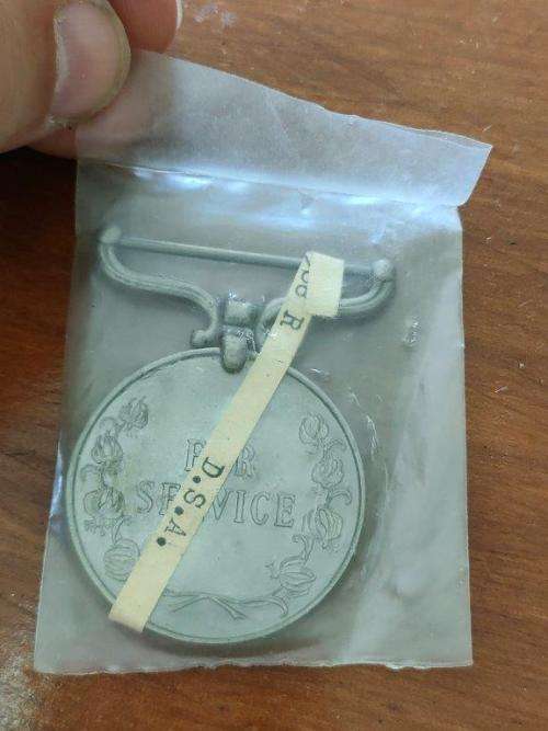 Rhodesain District Service Medal awarded to D.S.A. Mwaradze. In packet of issue.