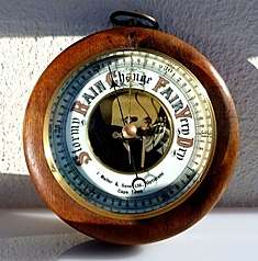 ANTIQUE BAROMETER,BEVELLED GLASS,PORCELAIN FACE,BRASS & WOOD,EXCELLENT CONDITION.